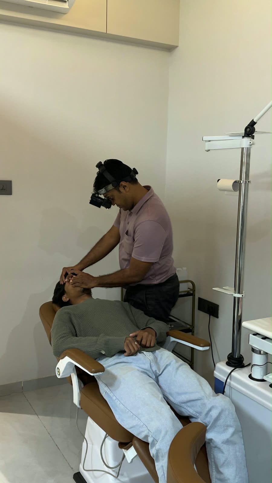 Dr. Vishvesh Agarwal examining a patient's eyes