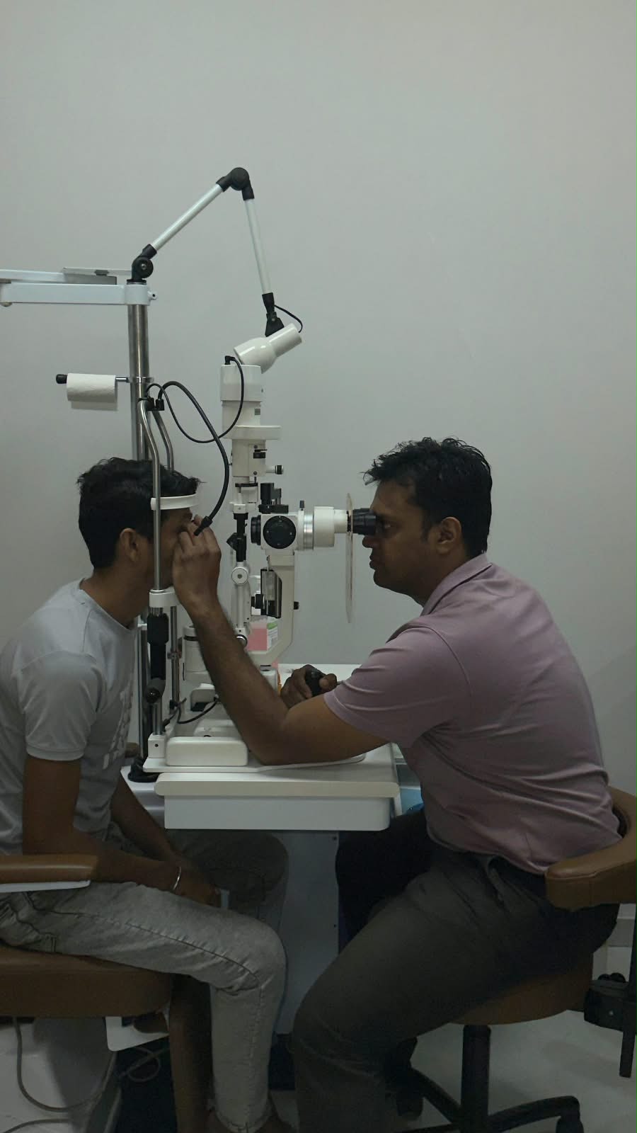 Patient slit lamp examination at V Care Eye Clinic
